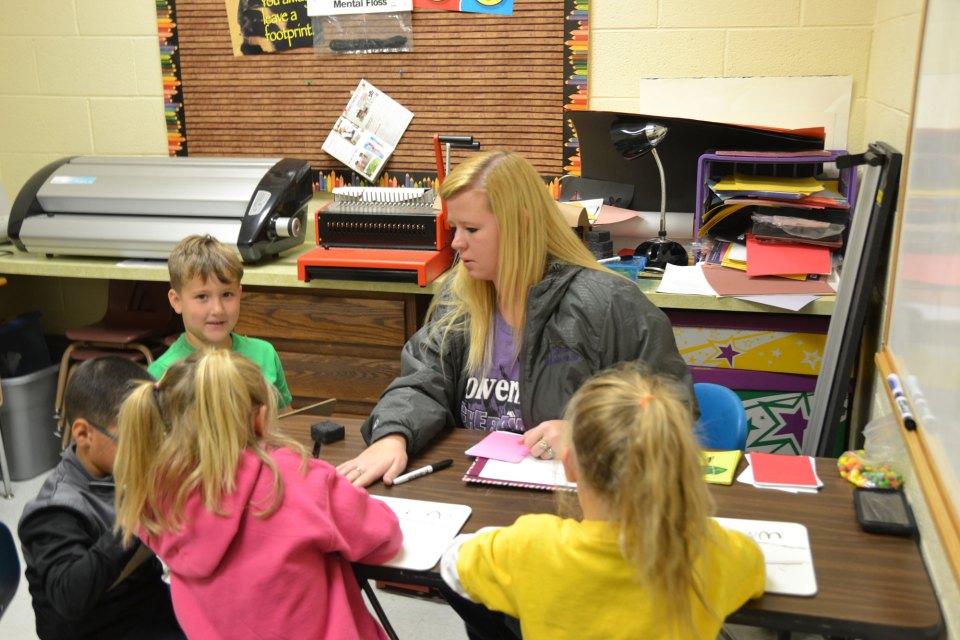 Kindergarteners get help with reading in Cheraw, Colorado. The district is working to improve results at its elementary school, which has been underperforming.