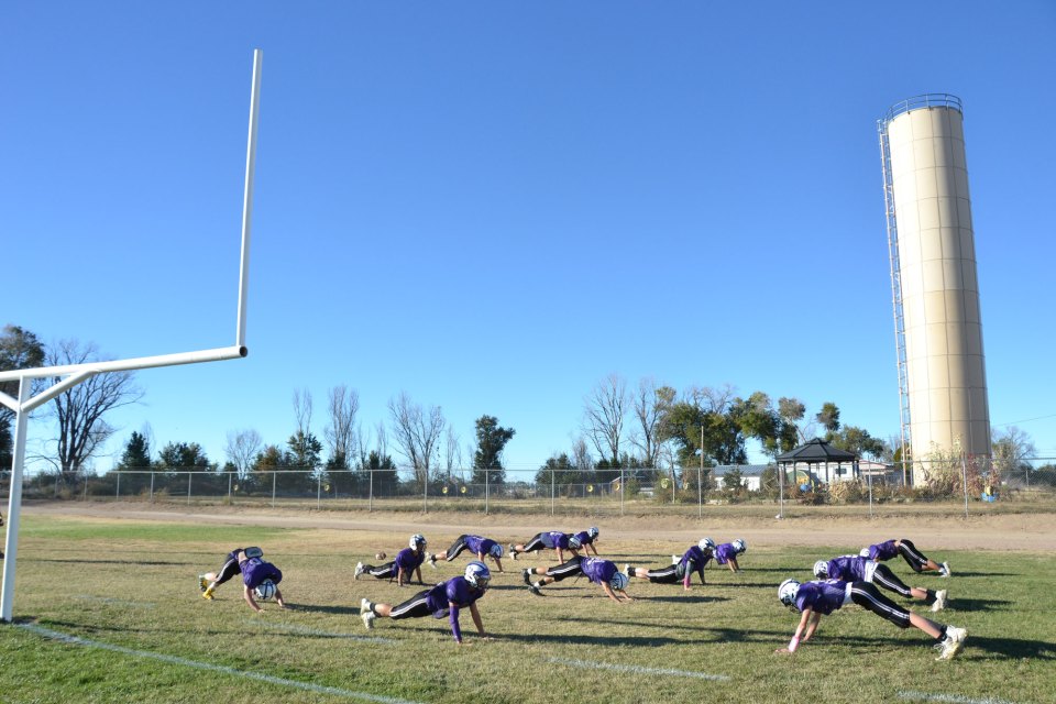 High schoolers practice on the football field in Cheraw, Colorado, a century-old town whose economy is based primarily around agriculture.