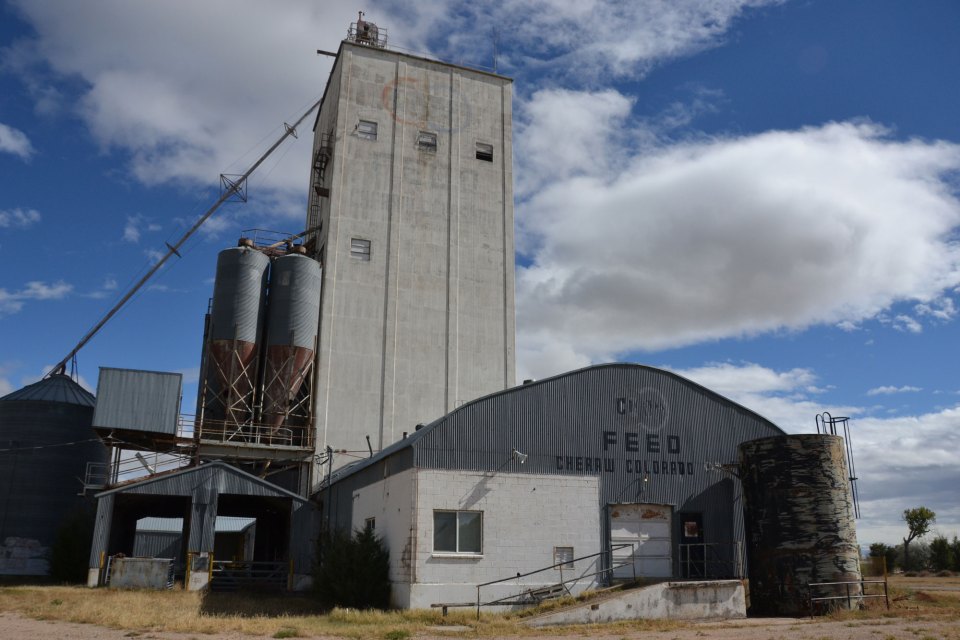 An old grain elevator rises in Cheraw, Colorado.